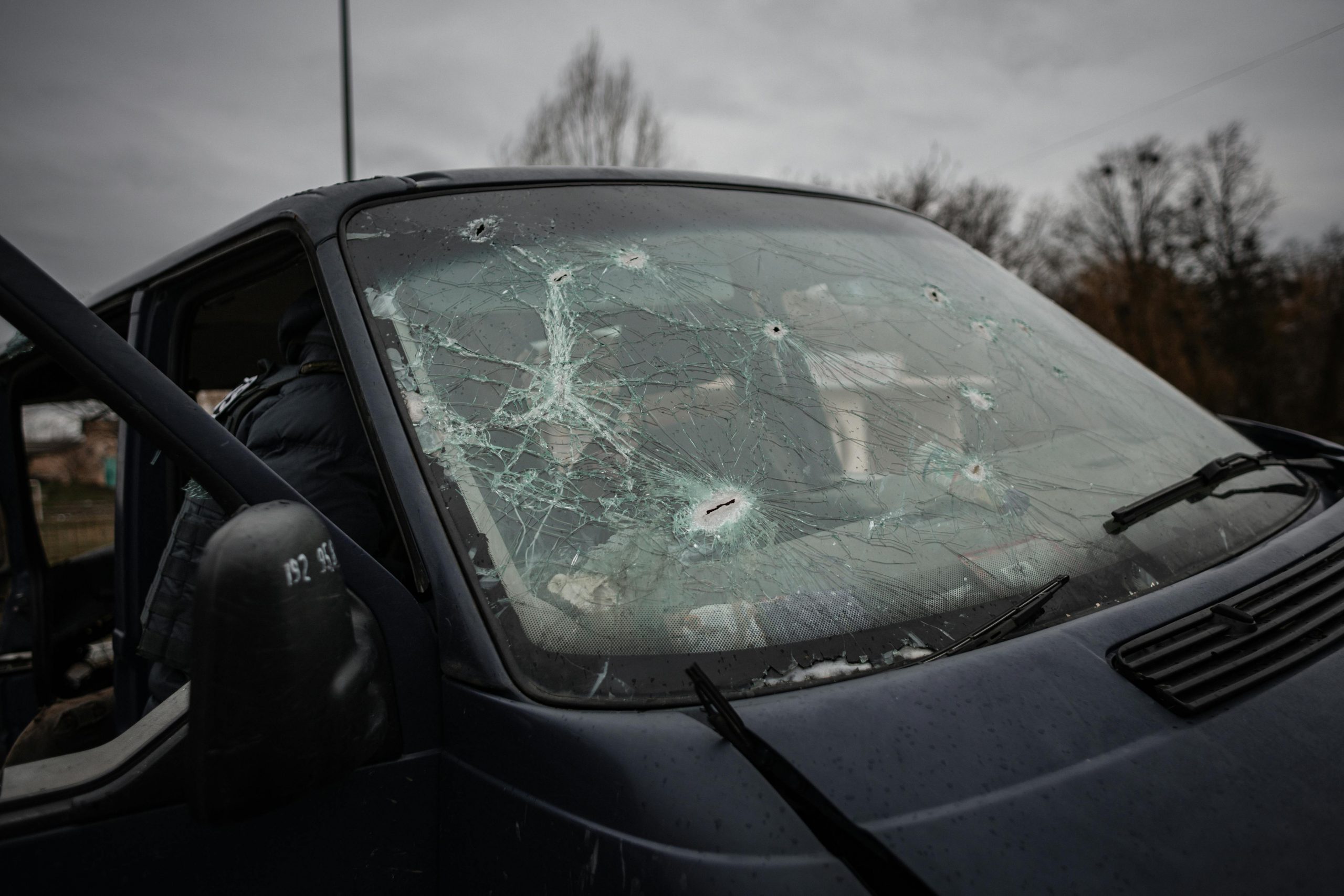 black van with a cracked windshield