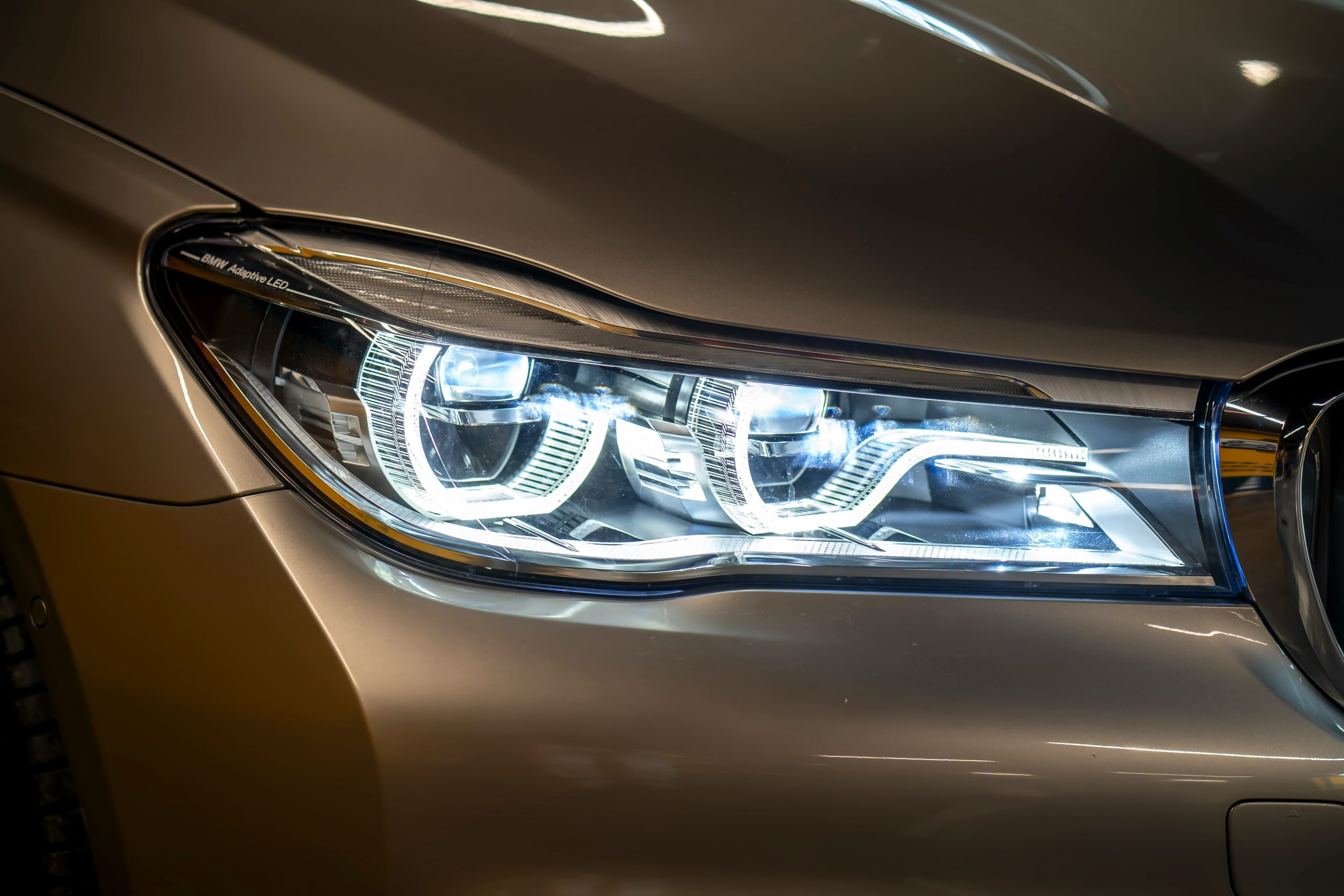 close-up of a beige car's headlight