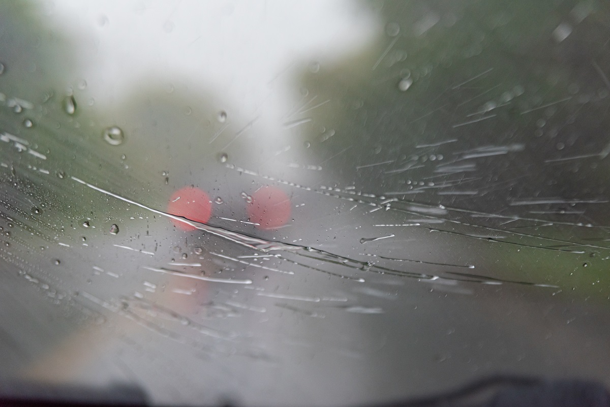 cracked windshield of a car on the road